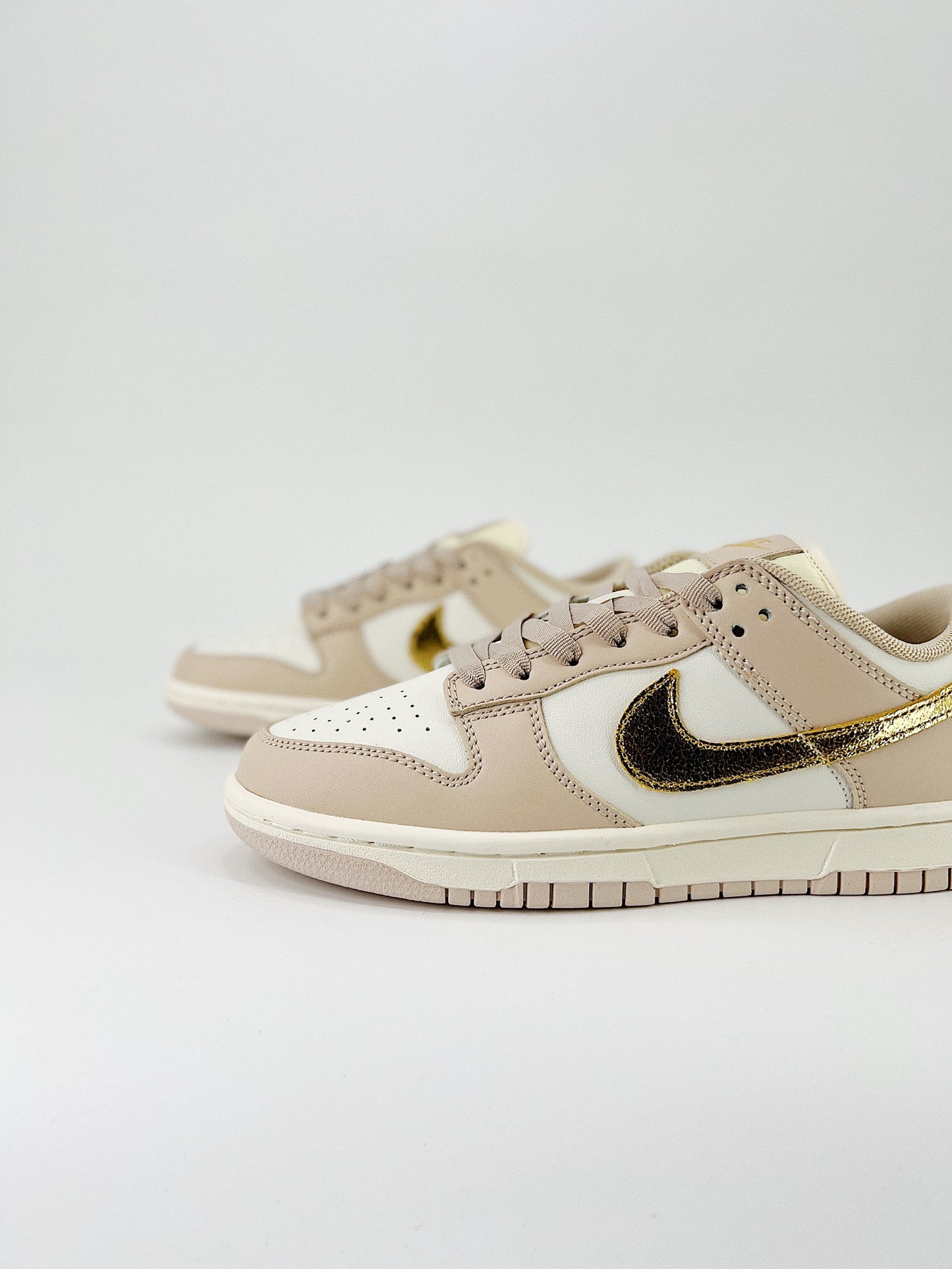 Nike Dunk Low “Gold Swoosh”