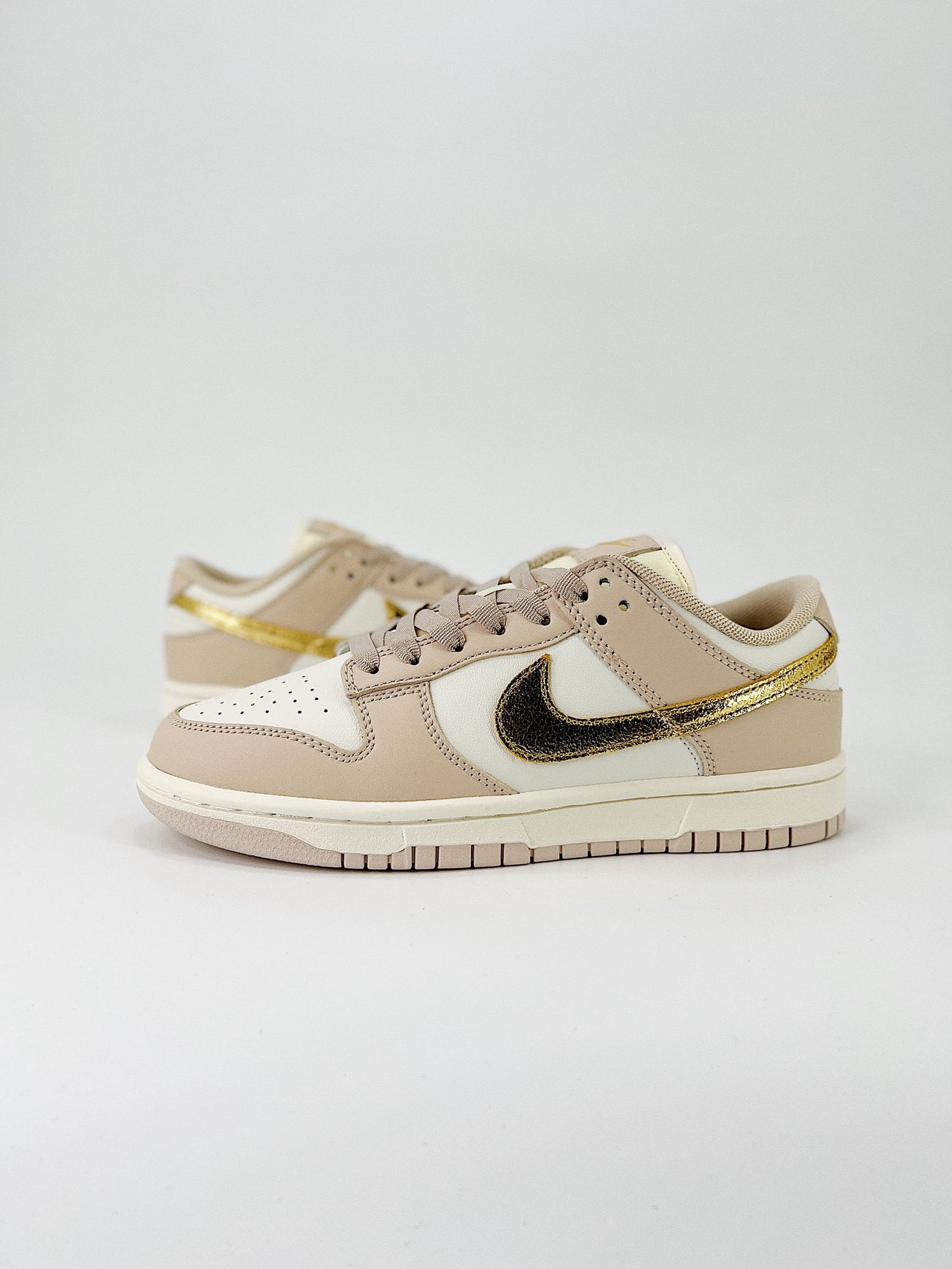 Nike Dunk Low “Gold Swoosh”