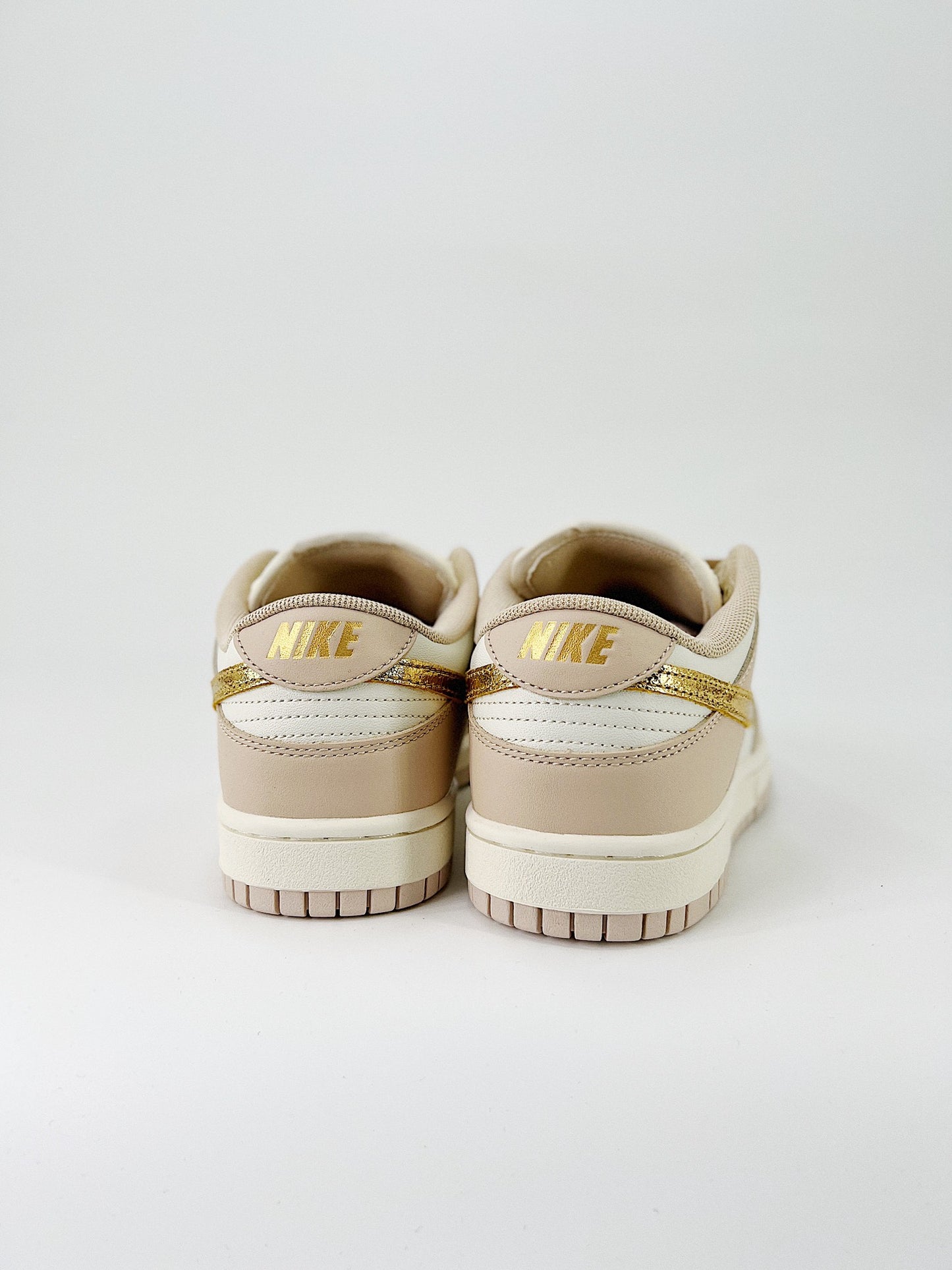 Nike Dunk Low “Gold Swoosh”