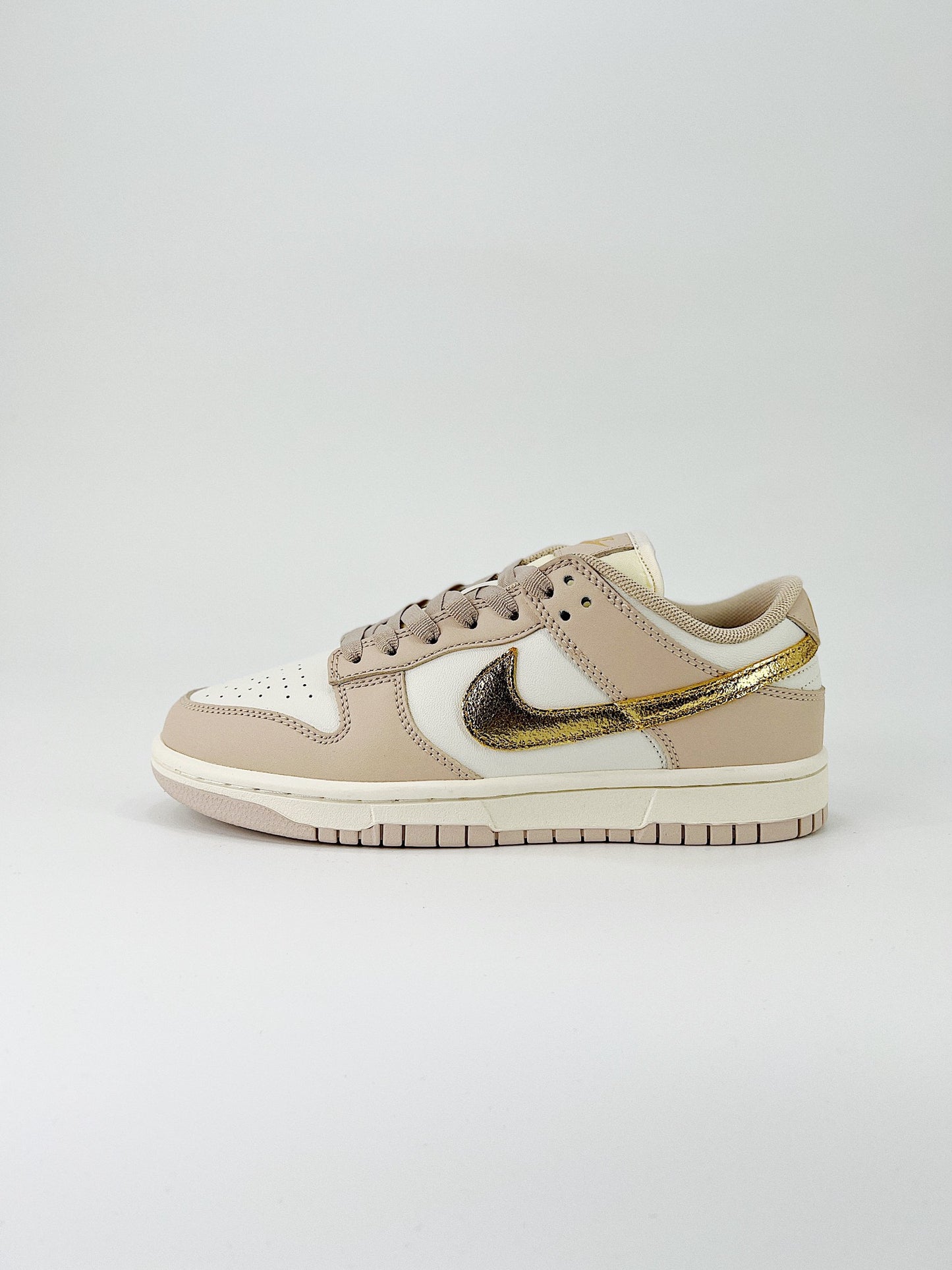 Nike Dunk Low “Gold Swoosh”